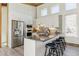 Modern kitchen featuring stainless steel appliances, granite countertops, and ample cabinet space at 2650 W Asbury Ave, Denver, CO 80219