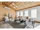 Cozy living room with a modern design including wood plank ceiling and bright natural light at 2650 W Asbury Ave, Denver, CO 80219