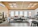 Cozy living room with a modern design including wood plank ceiling and bright natural light at 2650 W Asbury Ave, Denver, CO 80219