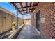 Outdoor patio area featuring a covered roof and a charming backyard setting at 5611 E 13Th Ave, Denver, CO 80220