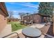 Spacious backyard featuring a patio, a grassy area, a skateboard ramp, and wood fencing at 5611 E 13Th Ave, Denver, CO 80220