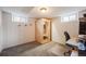 Finished basement area with sauna, carpeted floor, and paneled walls, perfect for relaxation at 5611 E 13Th Ave, Denver, CO 80220