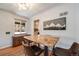 Bright dining area with a rustic wooden table and chairs, perfect for enjoying meals and gatherings at 5611 E 13Th Ave, Denver, CO 80220