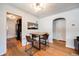 Cozy dining area with stylish light fixture, wooden table, and mountain-themed decor, ideal for intimate meals at 5611 E 13Th Ave, Denver, CO 80220