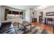 Cozy living room with large window, hardwood floors, and stylish furniture, perfect for comfortable living and entertaining at 5611 E 13Th Ave, Denver, CO 80220