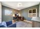 Spacious office with hardwood floors, dual windows, and a functional desk setup at 5611 E 13Th Ave, Denver, CO 80220