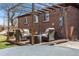 Cozy patio setup with comfortable seating around a fire pit and decorative string lights at 5611 E 13Th Ave, Denver, CO 80220
