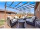 Backyard patio area with comfortable outdoor seating, a fire pit and an open pergola at 5611 E 13Th Ave, Denver, CO 80220