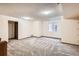 Finished basement offering ample space, carpeted flooring, and a window for natural light at 8040 Holland Ct # C, Arvada, CO 80005