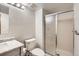 Bathroom featuring a shower with sliding glass door, and grey vanity at 8040 Holland Ct # C, Arvada, CO 80005