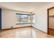 Sun-lit bedroom featuring wood floors and a large window offering neighborhood views at 8040 Holland Ct # C, Arvada, CO 80005