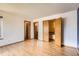 Spacious bedroom showcasing wood floors, natural light, and multiple closet doors at 8040 Holland Ct # C, Arvada, CO 80005