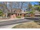 Exterior view of community featuring a brown two-story townhouse and community signage at 8040 Holland Ct # C, Arvada, CO 80005