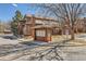 Exterior view of brown two-story home with mailbox stand on a sunny day at 8040 Holland Ct # C, Arvada, CO 80005