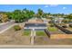 Charming home featuring solar panels, a fenced yard, and a welcoming entrance, perfect for sustainable living and outdoor enjoyment at 7450 Granada Rd, Denver, CO 80221