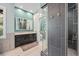 Modern bathroom featuring a double vanity, glass enclosed shower and fresh modern design at 10145 Meadow Run, Parker, CO 80134
