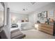 Bedroom featuring a dresser, night stands, and neutral paint colors perfect for getting a good nights rest at 10145 Meadow Run, Parker, CO 80134