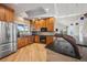 Modern kitchen featuring stainless steel appliances, granite countertops, and custom wood cabinetry at 10145 Meadow Run, Parker, CO 80134