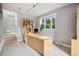 Bright home office with large desk, natural light, and a built in shelf perfect for working from home at 10145 Meadow Run, Parker, CO 80134
