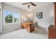 Office with hardwood desk, natural light, neutral walls, and ceiling fan at 10145 Meadow Run, Parker, CO 80134
