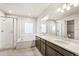Lavish bathroom featuring a shower, soaking tub, and double vanity at 21097 E 62Nd Dr, Aurora, CO 80019