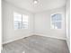 Bright bedroom featuring large windows and neutral carpeting at 21097 E 62Nd Dr, Aurora, CO 80019