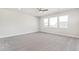 Spacious bedroom with plush carpet and large windows at 21097 E 62Nd Dr, Aurora, CO 80019