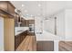 Gourmet kitchen with stainless steel appliances, a large island, and custom cabinetry at 21097 E 62Nd Dr, Aurora, CO 80019
