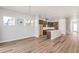 Open-concept living room flows into the gourmet kitchen with a center island at 21097 E 62Nd Dr, Aurora, CO 80019