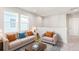 Cozy upstairs living area with comfortable seating and ample natural light at 21097 E 62Nd Dr, Aurora, CO 80019