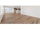 Hardwood floors flow throughout a large living area with recessed lighting at 21097 E 62Nd Dr, Aurora, CO 80019
