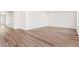 Spacious, light-filled room featuring gorgeous hardwood flooring and neutral walls at 21097 E 62Nd Dr, Aurora, CO 80019