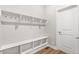 Mudroom provides built-in shelving and storage, offering the perfect drop zone from the garage at 21097 E 62Nd Dr, Aurora, CO 80019