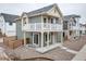 Charming two-story home with a cozy front patio, modern architectural design, and a gravel landscape at 46538 Avery Ln, Bennett, CO 80022