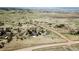 Broad aerial view of the sprawling property with multiple structures and open fields at 10554 Tanglewood Rd, Franktown, CO 80116
