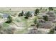 Expansive aerial view of the home on a large lot with outbuildings and mature trees at 10554 Tanglewood Rd, Franktown, CO 80116