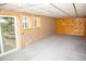 Spacious basement with carpet flooring, natural wood accents, and natural light from windows and sliding glass door at 10554 Tanglewood Rd, Franktown, CO 80116