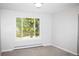 Clean and cozy bedroom with large sunny window, new neutral carpet and fresh paint at 10554 Tanglewood Rd, Franktown, CO 80116