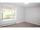 A spacious bedroom with a large bay window that offers lots of natural light at 10554 Tanglewood Rd, Franktown, CO 80116