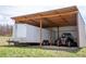 Large garage includes an enclosed trailer and an ATV at 10554 Tanglewood Rd, Franktown, CO 80116