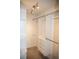 Well-organized walk-in closet featuring white shelving and drawers for storage efficiency at 10554 Tanglewood Rd, Franktown, CO 80116