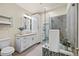 Modern bathroom featuring a glass shower, floating vanity and great natural light at 3880 E 128Th Way, Thornton, CO 80241