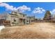 Spacious, fully fenced backyard with a covered patio, offering ample space for outdoor enjoyment at 7768 Xavier Ct, Westminster, CO 80030