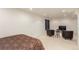 A carpeted basement bedroom features neutral walls and recessed lighting for comfortable living at 7768 Xavier Ct, Westminster, CO 80030