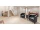 Finished basement area with seating, bedroom, stairs, and carpeted floor at 7768 Xavier Ct, Westminster, CO 80030