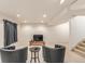 A finished basement is designed with recessed lighting, comfortable seating, and a media center at 7768 Xavier Ct, Westminster, CO 80030