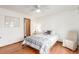 Bedroom featuring hardwood floors, a ceiling fan, and a small table on the side at 7768 Xavier Ct, Westminster, CO 80030