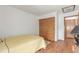 Bedroom featuring a bed with wood-look floors and closet at 7768 Xavier Ct, Westminster, CO 80030
