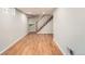 Finished basement with hardwood floors and stairway at 1548 Ulster St, Denver, CO 80220