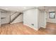 Finished basement with hardwood floors and recessed lighting at 1548 Ulster St, Denver, CO 80220